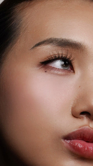 Model wearing Twilight brown magnetic eyelashes with a warm natural finish — view 2